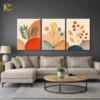 Three piece boho wall art set featuring Colourful Plants Leaves Illustrations with geometric shapes, orange circles, and green branches on a beige background.