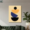 Modern Stacked Semicircles wall art featuring a black circle balancing on orange and navy blue geometric shapes against a beige background.