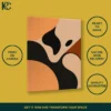 Abstract wall art with black, brown, and beige curvy shapes on an orange background.