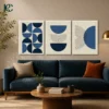 Set of 3 navy blue geometric semi-circles and arch lines wall art above a dark blue sofa.